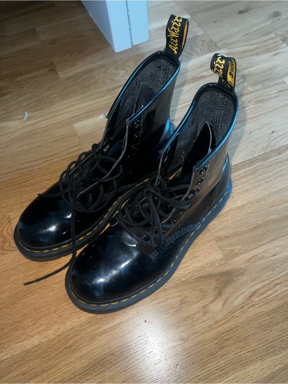 Dr. Martens Black Patent 8-Eye Lace-Up Boots with Yellow Stitching